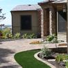 Faux-stone blankets the entry. Plant materials and artificial sod lend balance to the hardscape aspect of the job; all for a visually appealing entryway. Oh, and the view!