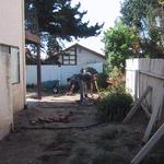 Entry side yard needs new fencing as well as a "defined" area for utility use that separates it from the rear "ornamental" yard.