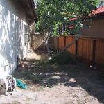 A side yard that has no gate to the front yard and is rarely used is important in only the view it provides fron the vantage point of the rear yard and the kitchen windows.