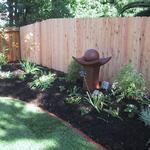 New fencing, the continuation of the mow strip, new lawn and plantings are all topped off with a water feature that provides the soothing sound of the water flow as well as a drawing point for birds. Very pleasant!